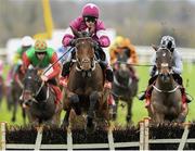 25 November 2023; Predators Gold, with Paul Townend up, jump the last on their way to winning the CourtClinic.ie Chartered Physiotherapists Supporting Kilmacud Crokes GAA Maiden Hurdle on day one of the Punchestown Winter Festival at Punchestown Racecourse in Kildare. Photo by Matt Browne/Sportsfile