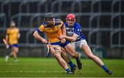 25 November 2023; Peter Feeney of Na Fianna in action against James Burke of Naas during the AIB Leinster GAA Hurling Senior Club Championship semi-final match between Naas, Kildare, and Na Fianna, Dublin, at Laois Hire O’Moore Park in Portlaoise, Laois. Photo by Eóin Noonan/Sportsfile