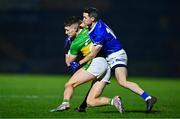 25 November 2023; Jody McDermott of Glen is tackled by Brendan McDyer of Naomh Conaill during the AIB Ulster GAA Football Senior Club Championship semi-final match between Glen, Derry, and Naomh Conaill, Donegal, at Healy Park in Omagh, Tyrone. Photo by Ben McShane/Sportsfile