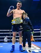 25 November 2023; Emmet Brennan, with his godson Ollie, after defeating Jamie Morrissey in their BUI Celtic light-heavyweight bout  at the 3Arena in Dublin. Photo by Stephen McCarthy/Sportsfile