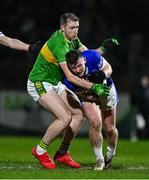 25 November 2023; Jeaic Mac Ceallbhuí of Naomh Conaill is tackled by Emmett Bradley of Glen during the AIB Ulster GAA Football Senior Club Championship semi-final match between Glen, Derry, and Naomh Conaill, Donegal, at Healy Park in Omagh, Tyrone. Photo by Ben McShane/Sportsfile