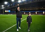 25 November 2023; Former Leinster captain Jonathan Sexton is introduced to the crowd alongside his son Luca before the United Rugby Championship match between Leinster and Munster at the Aviva Stadium in Dublin. Photo by Harry Murphy/Sportsfile