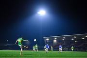 25 November 2023; Emmett Bradley of Glen kicks a free during the AIB Ulster GAA Football Senior Club Championship semi-final match between Glen, Derry, and Naomh Conaill, Donegal, at Healy Park in Omagh, Tyrone. Photo by Ben McShane/Sportsfile