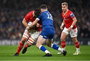 25 November 2023; Jean Kleyn of Munster is tackled by Robbie Henshaw of Leinster during the United Rugby Championship match between Leinster and Munster at the Aviva Stadium in Dublin. Photo by David Fitzgerald/Sportsfile