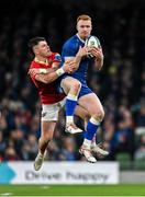 25 November 2023; Ciarán Frawley of Leinster in action against Calvin Nash of Munster during the United Rugby Championship match between Leinster and Munster at the Aviva Stadium in Dublin. Photo by Sam Barnes/Sportsfile