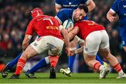 25 November 2023; Jack Conan of Leinster is tackled by John Hodnett and Jeremy Loughman of Munster during the United Rugby Championship match between Leinster and Munster at the Aviva Stadium in Dublin. Photo by Harry Murphy/Sportsfile