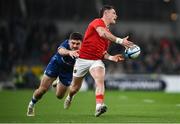 25 November 2023; Calvin Nash of Munster is tackled by Jimmy O'Brien of Leinster during the United Rugby Championship match between Leinster and Munster at the Aviva Stadium in Dublin. Photo by David Fitzgerald/Sportsfile