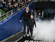 25 November 2023; Former Leinster captain Jonathan Sexton is introduced to the crowd alongside his son Luca before the United Rugby Championship match between Leinster and Munster at the Aviva Stadium in Dublin. Photo by Harry Murphy/Sportsfile
