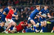 25 November 2023; Ciarán Frawley of Leinster is tackled by Diarmuid Barron of Munster during the United Rugby Championship match between Leinster and Munster at the Aviva Stadium in Dublin. Photo by Harry Murphy/Sportsfile