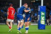 25 November 2023; Jamison Gibson-Park of Leinster, right, is congratulated by team-mate Josh van der Flier after scoring his side's first try during the United Rugby Championship match between Leinster and Munster at the Aviva Stadium in Dublin. Photo by Sam Barnes/Sportsfile