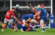 25 November 2023; Tadhg Beirne of Munster offloads as he is tackled by Ciarán Frawley of Leinster during the United Rugby Championship match between Leinster and Munster at the Aviva Stadium in Dublin. Photo by David Fitzgerald/Sportsfile