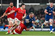 25 November 2023; Andrew Porter of Leinster is tackled by Jack Crowley of Munster during the United Rugby Championship match between Leinster and Munster at the Aviva Stadium in Dublin. Photo by Harry Murphy/Sportsfile