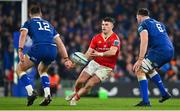25 November 2023; Calvin Nash of Munster in action against Jack Conan of Leinster, right, and Robbie Henshaw during the United Rugby Championship match between Leinster and Munster at the Aviva Stadium in Dublin. Photo by Tyler Miller/Sportsfile