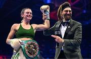 25 November 2023; Skye Nicolson, with MC David Diamante, after defeating Lucy Wildheart in their Interim WBC featherweight world bout at the 3Arena in Dublin. Photo by Stephen McCarthy/Sportsfile