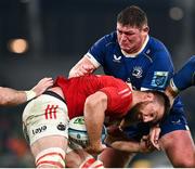 25 November 2023; Jean Kleyn of Munster is tackled by Tadhg Furlong of Leinster during the United Rugby Championship match between Leinster and Munster at the Aviva Stadium in Dublin. Photo by Harry Murphy/Sportsfile