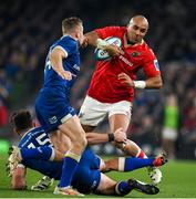 25 November 2023; Simon Zebo of Munster is tackled by Hugo Keenan, bottom, and Jordan Larmour of Leinster during the United Rugby Championship match between Leinster and Munster at the Aviva Stadium in Dublin. Photo by Sam Barnes/Sportsfile
