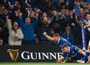 25 November 2023; Jordan Larmour of Leinster celebrates with teammate Garry Ringrose after scoring his side's third try during the United Rugby Championship match between Leinster and Munster at the Aviva Stadium in Dublin. Photo by Harry Murphy/Sportsfile