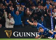 25 November 2023; Jordan Larmour of Leinster celebrates with teammate Garry Ringrose after scoring his side's third try during the United Rugby Championship match between Leinster and Munster at the Aviva Stadium in Dublin. Photo by Harry Murphy/Sportsfile