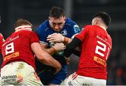 25 November 2023; Jack Conan of Leinster is tackled by Gavin Coombes and Conor Murray of Munster during the United Rugby Championship match between Leinster and Munster at the Aviva Stadium in Dublin. Photo by Harry Murphy/Sportsfile