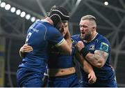 25 November 2023; Jordan Larmour of Leinster, centre, is congratulated by team mates Caelan Doris, left, and Andrew Porter after scoring their third try during the United Rugby Championship match between Leinster and Munster at the Aviva Stadium in Dublin. Photo by David Fitzgerald/Sportsfile