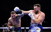 25 November 2023; Thomas Carty, right, and Dan Garber during their heavyweight bout at the 3Arena in Dublin. Photo by Stephen McCarthy/Sportsfile