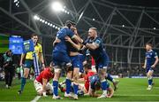 25 November 2023; Jordan Larmour of Leinster, centre, is congratulated by team mates Caelan Doris, left, and Andrew Porter after scoring their third try  during the United Rugby Championship match between Leinster and Munster at the Aviva Stadium in Dublin. Photo by David Fitzgerald/Sportsfile