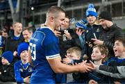 25 November 2023; Scott Penny of Leinster shakes hands with young supporters after his side's victory in the United Rugby Championship match between Leinster and Munster at the Aviva Stadium in Dublin. Photo by Tyler Miller/Sportsfile