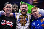 25 November 2023; Thomas Carty, with his coach Packie Collins, after defeating Dan Garber in their heavyweight bout at the 3Arena in Dublin. Photo by Stephen McCarthy/Sportsfile