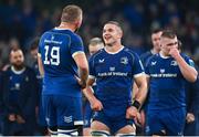 25 November 2023; Leinster players Scott Penny, centre, and Ross Molony share a joke after their side's victory in the United Rugby Championship match between Leinster and Munster at the Aviva Stadium in Dublin. Photo by Sam Barnes/Sportsfile