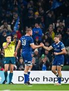 25 November 2023; Leinster players Ross Molony, left, and Jordan Larmour celebrate as referee Chris Busby blows the final whistle during the United Rugby Championship match between Leinster and Munster at the Aviva Stadium in Dublin. Photo by Sam Barnes/Sportsfile