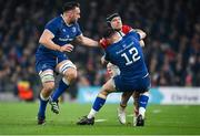 25 November 2023; Rory Scannell of Munsteris tackled by Robbie Henshaw of Leinster, supported by Jack Conan during the United Rugby Championship match between Leinster and Munster at the Aviva Stadium in Dublin. Photo by Sam Barnes/Sportsfile