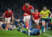 25 November 2023; Conor Murray of Munster evades the tackle of Robbie Henshaw of Leinster during the United Rugby Championship match between Leinster and Munster at the Aviva Stadium in Dublin. Photo by Sam Barnes/Sportsfile