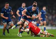 25 November 2023; Joe McCarthy of Leinster is tackled by Shane Daly of Munster during the United Rugby Championship match between Leinster and Munster at the Aviva Stadium in Dublin. Photo by David Fitzgerald/Sportsfile