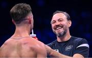 25 November 2023; Paddy Donovan celebrates with trainer Andy Lee after defeating Danny Ball during their WBA Continental welterweight bout at the 3Arena in Dublin. Photo by Stephen McCarthy/Sportsfile