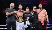 25 November 2023; Paddy Donovan celebrates with his backroom team, including trainer Andy Lee, left, after defeating Danny Ball during their WBA Continental welterweight bout at the 3Arena in Dublin. Photo by Stephen McCarthy/Sportsfile