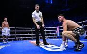 25 November 2023; Danny Ball, right, recovers from a fourth round knockdown by Paddy Donovan during their WBA Continental welterweight bout at the 3Arena in Dublin. Photo by Stephen McCarthy/Sportsfile