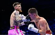 25 November 2023; Gary Cully, left, and Reece Mould during their WBA Continental Europe lightweight bout at the 3Arena in Dublin. Photo by Stephen McCarthy/Sportsfile