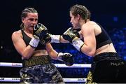 25 November 2023; Chantelle Cameron, left, and Katie Taylor during their undisputed super lightweight championship bout at the 3Arena in Dublin. Photo by Stephen McCarthy/Sportsfile