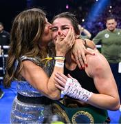 25 November 2023; Katie Taylor celebrates with her mother Bridget Taylor after defeating Chantelle Cameron in their undisputed super lightweight championship fight at the 3Arena in Dublin. Photo by Stephen McCarthy/Sportsfile