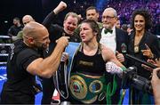 25 November 2023; Katie Taylor celebrates with her team, including trainer Ross Enamait, and manager Brian Peters, after defeating Chantelle Cameron in their undisputed super lightweight championship fight at the 3Arena in Dublin. Photo by Stephen McCarthy/Sportsfile
