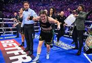 25 November 2023; Katie Taylor celebrates defeating Chantelle Cameron in their undisputed super lightweight championship fight at the 3Arena in Dublin. Photo by Stephen McCarthy/Sportsfile