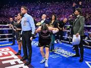 25 November 2023; Katie Taylor celebrates as she is announced victorious against Chantelle Cameron in their undisputed super lightweight championship fight at the 3Arena in Dublin. Photo by Stephen McCarthy/Sportsfile