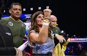 25 November 2023; Bridget Taylor, mother of Katie Taylor, and cutman Mike Rodriguez, celebrate as the result is announced of the undisputed super lightweight championship fight against Chantelle Cameron at the 3Arena in Dublin. Photo by Stephen McCarthy/Sportsfile