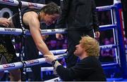 25 November 2023; Katie Taylor is congratulated by singer Ed Sheeran after defeating Chantelle Cameron in her undisputed super lightweight championship fight at the 3Arena in Dublin. Photo by Stephen McCarthy/Sportsfile