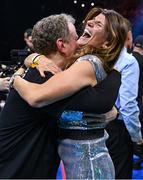 25 November 2023; Bridget Taylor, mother of Katie Taylor, and manager Brian Peters celebrate Katie Taylor's victory in the undisputed super lightweight championship fight against Chantelle Cameron at the 3Arena in Dublin. Photo by Stephen McCarthy/Sportsfile