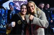 25 November 2023; Katie Taylor celebrates with boxer Amy Broadhurst, right, after defeating Chantelle Cameron in her undisputed super lightweight championship fight at the 3Arena in Dublin. Photo by Stephen McCarthy/Sportsfile