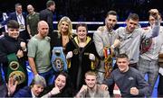 25 November 2023; Katie Taylor celebrates with family after defeating Chantelle Cameron in their undisputed super lightweight championship fight at the 3Arena in Dublin. Photo by Stephen McCarthy/Sportsfile