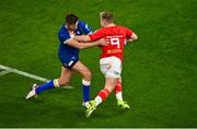 25 November 2023; Craig Casey of Munster evades the tackle of Ross Byrne of Leinster while on his way to scoring his side's first try during the United Rugby Championship match between Leinster and Munster at the Aviva Stadium in Dublin. Photo by Tyler Miller/Sportsfile