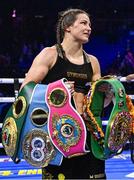 25 November 2023; Katie Taylor with her belts after defeating Chantelle Cameron in their undisputed super lightweight championship fight at the 3Arena in Dublin. Photo by Stephen McCarthy/Sportsfile