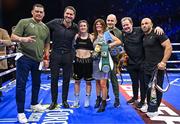 25 November 2023; Katie Taylor celebrates with her backroom team, from left, cutman Mike Rodriguez, promoter Eddie Hearn, mother Bridget Taylor, Tomas Rohan, manager Brian Peters and trainer Ross Enamait, after defeating Chantelle Cameron in their undisputed super lightweight championship fight at the 3Arena in Dublin. Photo by Stephen McCarthy/Sportsfile